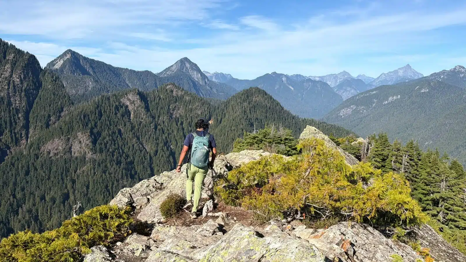 Narrow ridge beyond Evans Peak leading toward a steep viewpoint