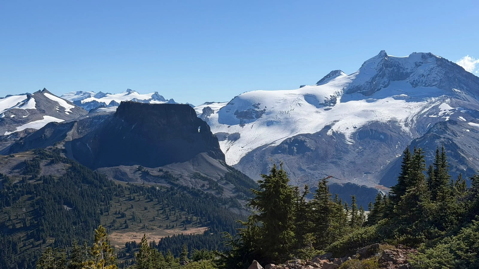 The Table’s dark flat-topped cliffs in front of the snow-covered Mount Garibaldi massif