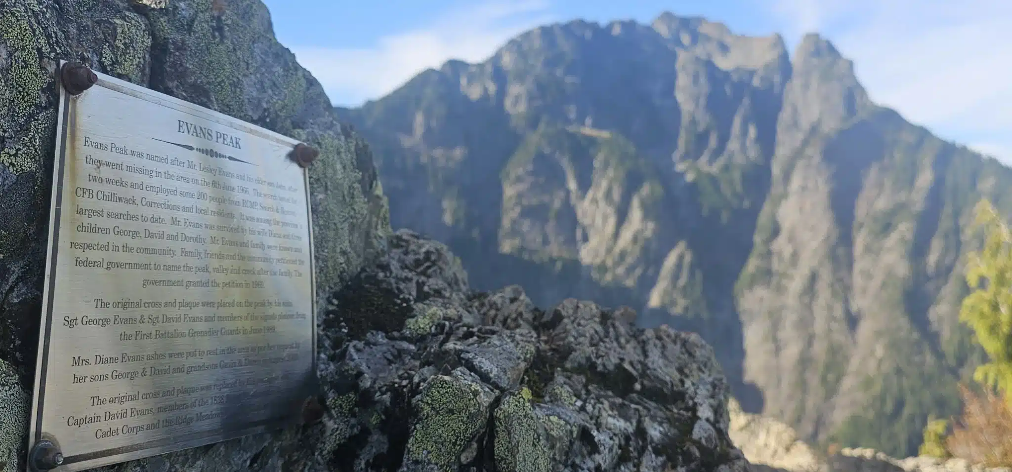 Memorial plaque for Lesley Evans and John Evans on Evans Peak with Golden Ears behind