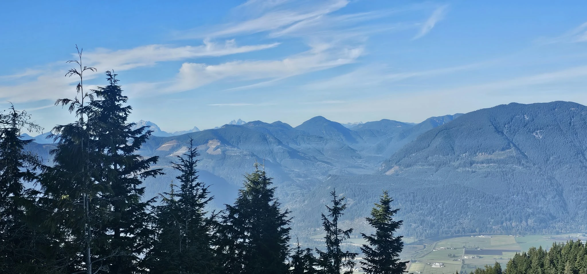 Northwest mountain panorama from Sumas Mountain toward Golden Ears, Mount Robie Reid, Mount Judge Howay, The Defendant and The Witness