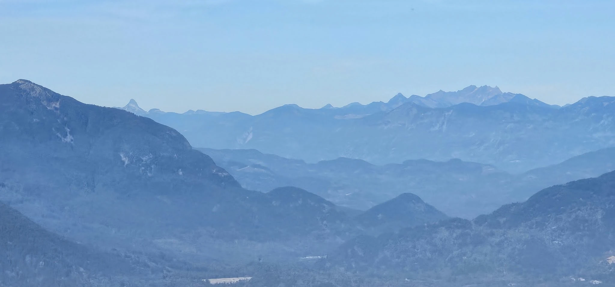 Distant mountain view from Sumas Mountain toward the Coquihalla and North Cascades corridor