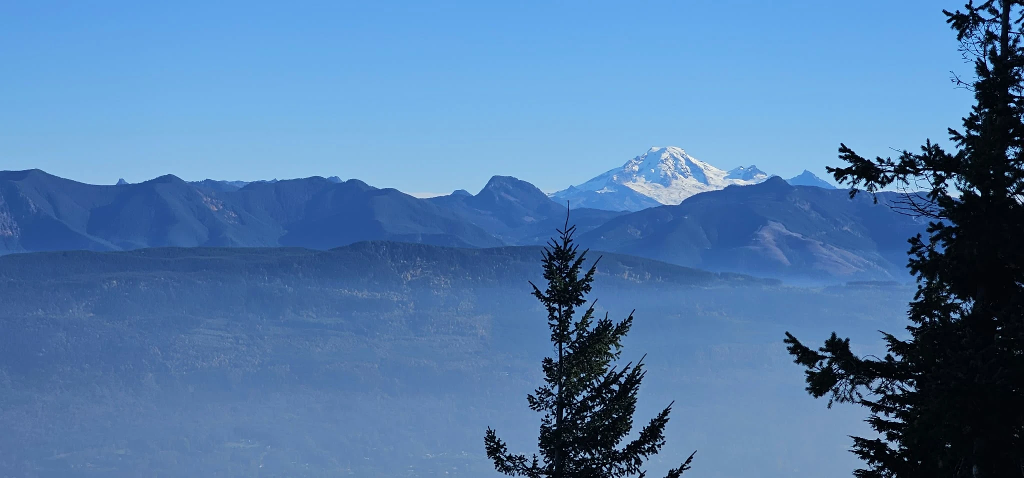 Mount Baker seen from the Baker Rock viewpoint beyond the Sumas Mountain summit and Eastern Lookout